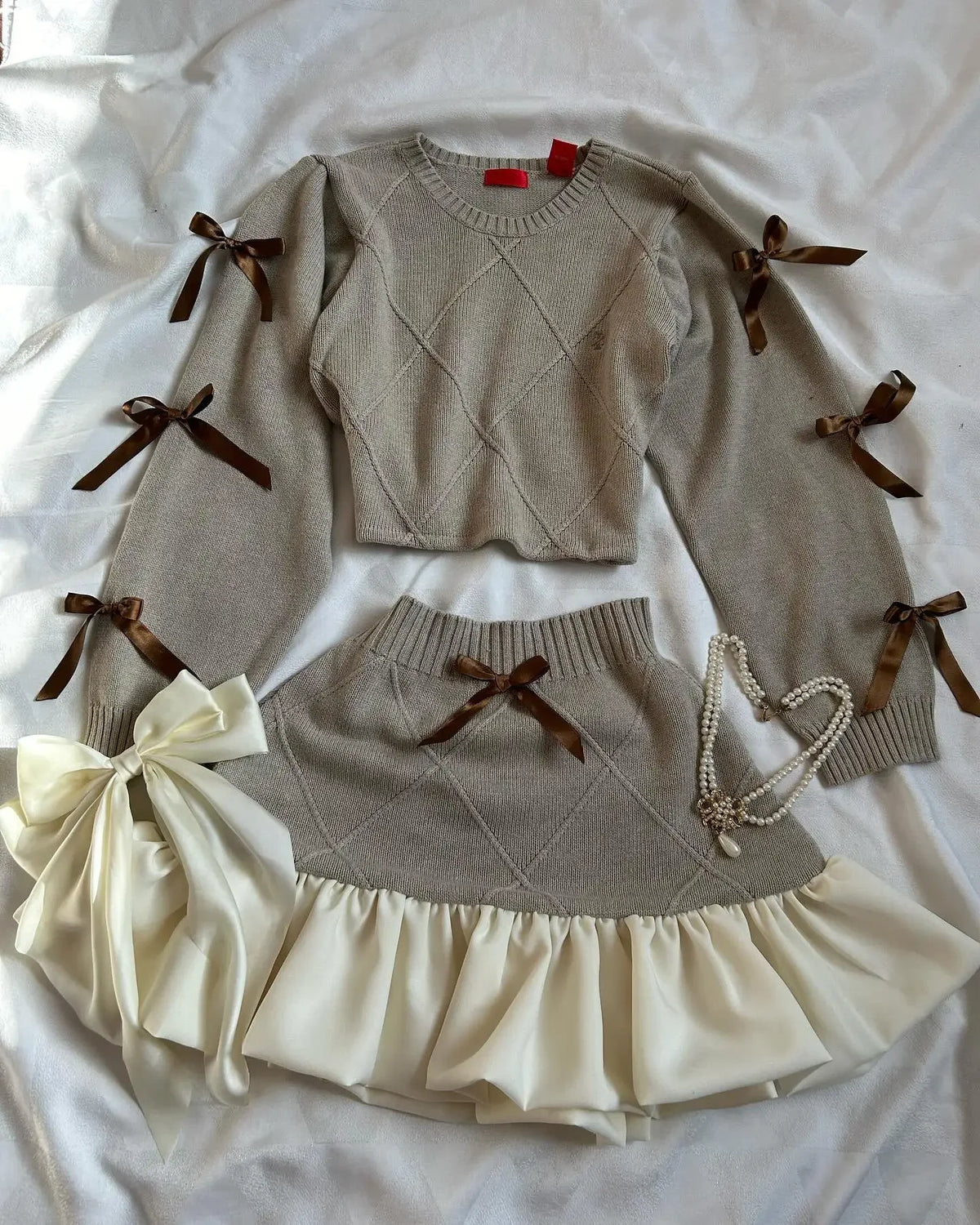 STORESDE Fashion Trend Y2k Knitted Splicing Two Piece Set Women Bow Long Sleeve Knitted Slimming Sexy Top Mini Pleated Skirt Autumn Set