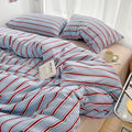 STORESDE Simple Red and Blue Striped Duvet Cover and Four Piece Bed Sheet Set with Washed Cotton Bedding on the Bed